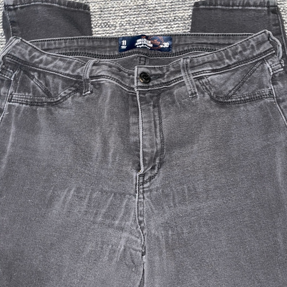 Distressed black jeggings